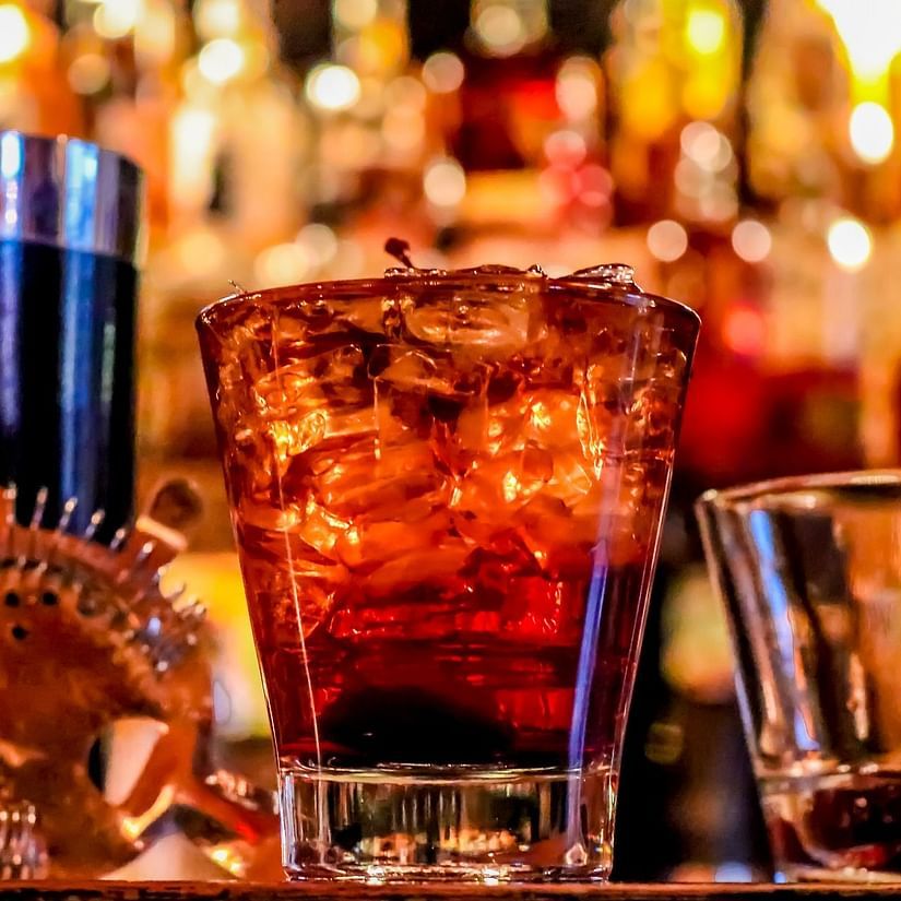 a bar counter table where drinks are kept