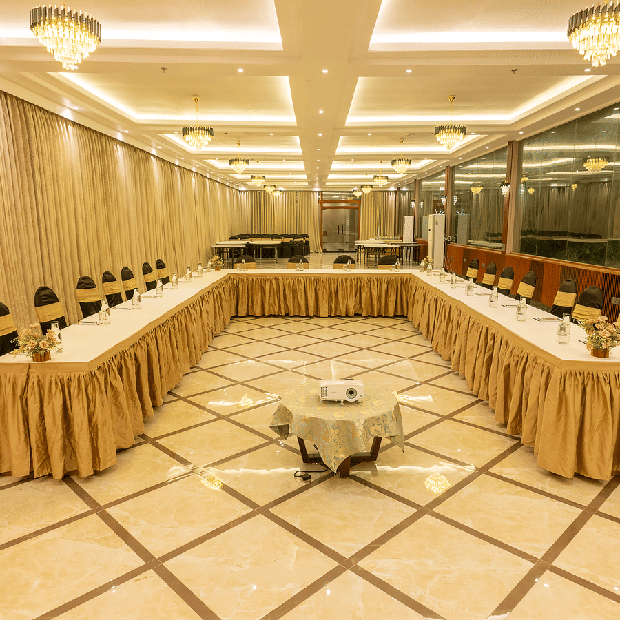 Conference hall with U-shaped table setup and draped decor at Silver Sand Sea Princess Beach Resort, Port Blair.