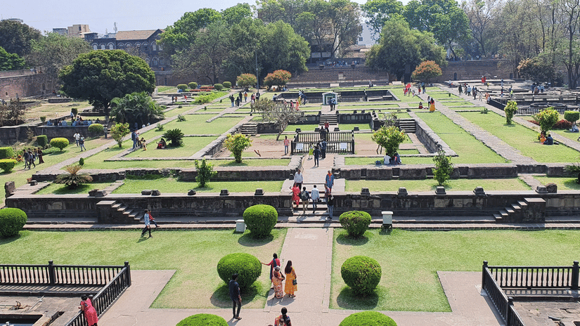 Landscaped courtyards and palace foundations inside Shaniwar Wada in Pune.