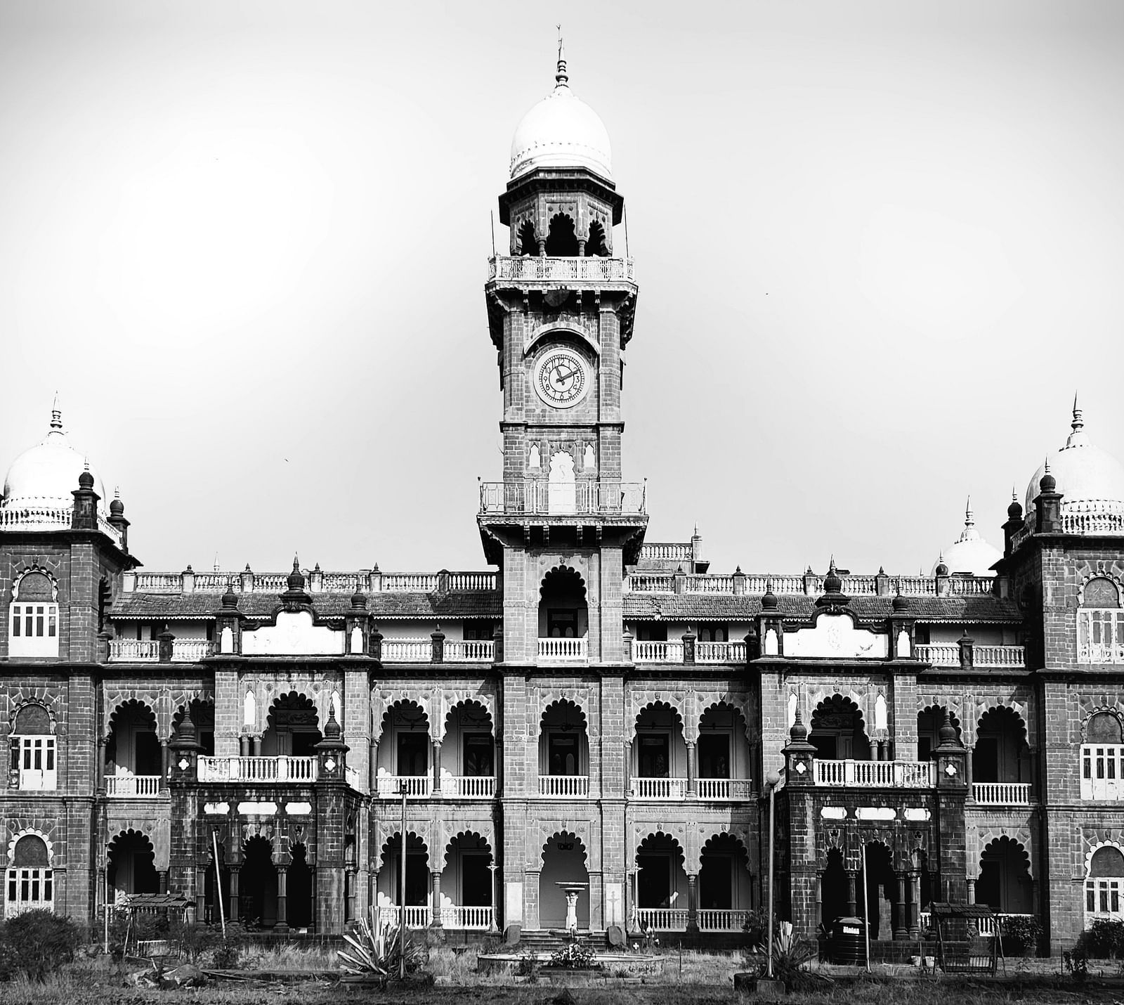 Facade of a historical building in black and white, showcasing intricate architecture