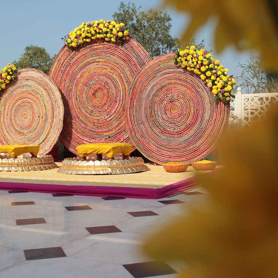 a stage set up on the terrace for the bride and groom with good decorations - heritage village resorts & spa, Manesar
