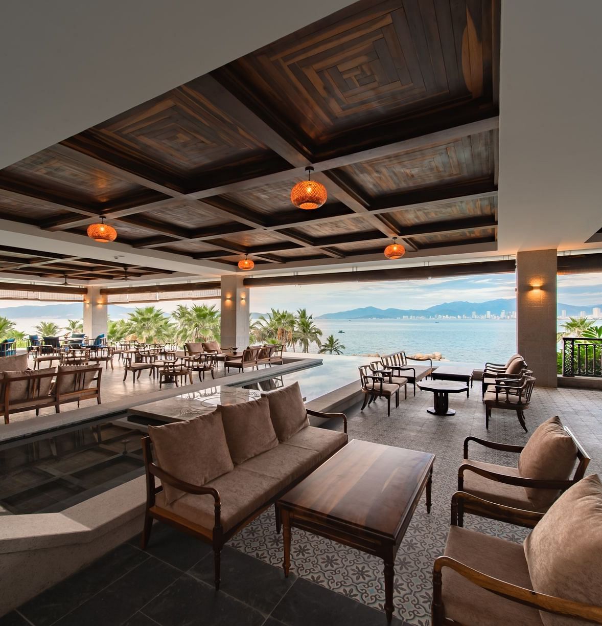 An image of a huge sitting area of with several chairs and centre tables - Alibu Resort Nha Thrang