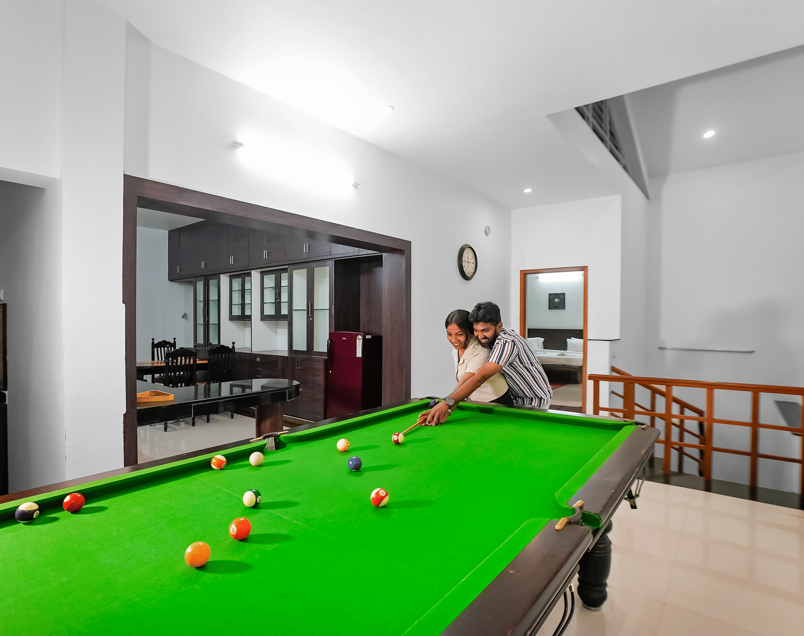 A view of a couple playing pool at WOW Bungalow, Yercaud. 