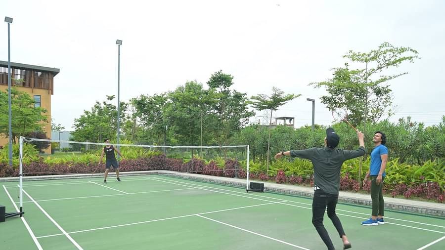 People playing badminton at Singalila Club