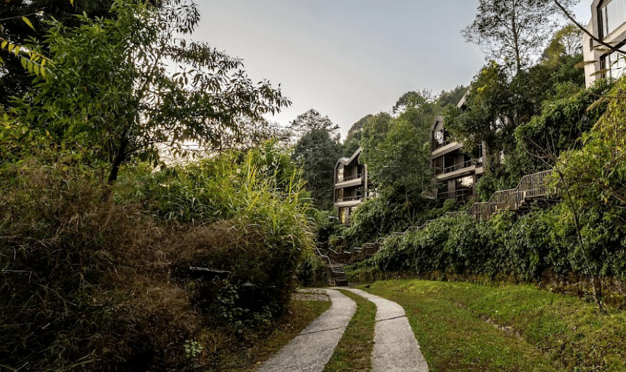 A narrow two lane pavement leading a cottage |  Kavya Resort and Spa, Nagarkot