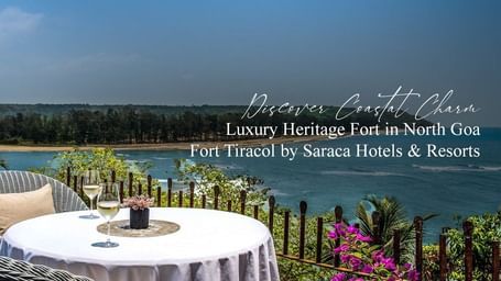 Rooftop dining setup with a scenic ocean view at Fort Tiracol, Goa.