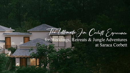 Modern multi-level resort building at Saraca Corbett surrounded by forest greenery, with text promoting the ultimate Corbett experience for wellness retreats and jungle adventures.