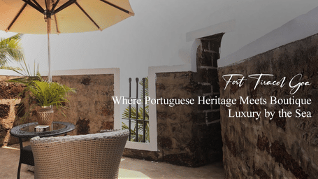Outdoor patio at Saraca Hotel & Resort with wicker chairs, umbrella, stone walls and palm tree, with text highlighting Portuguese heritage and boutique luxury by the sea.