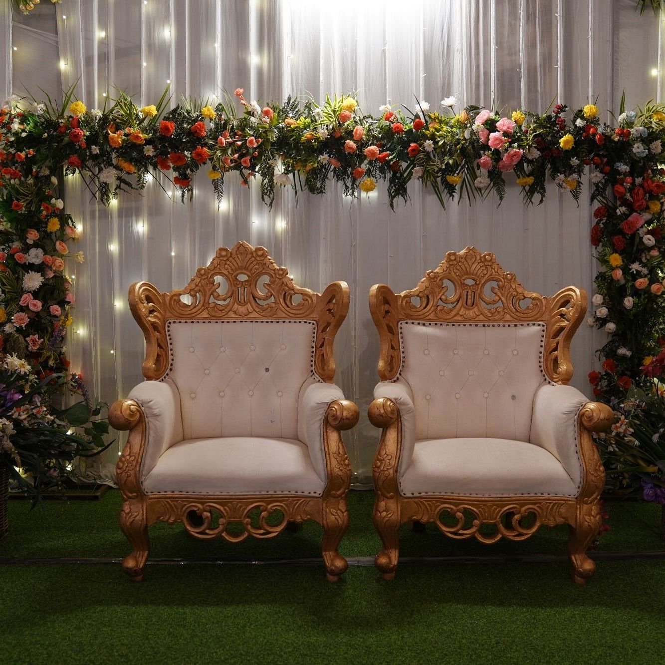 A closeup view the decorated stage with flowers - The zion.
