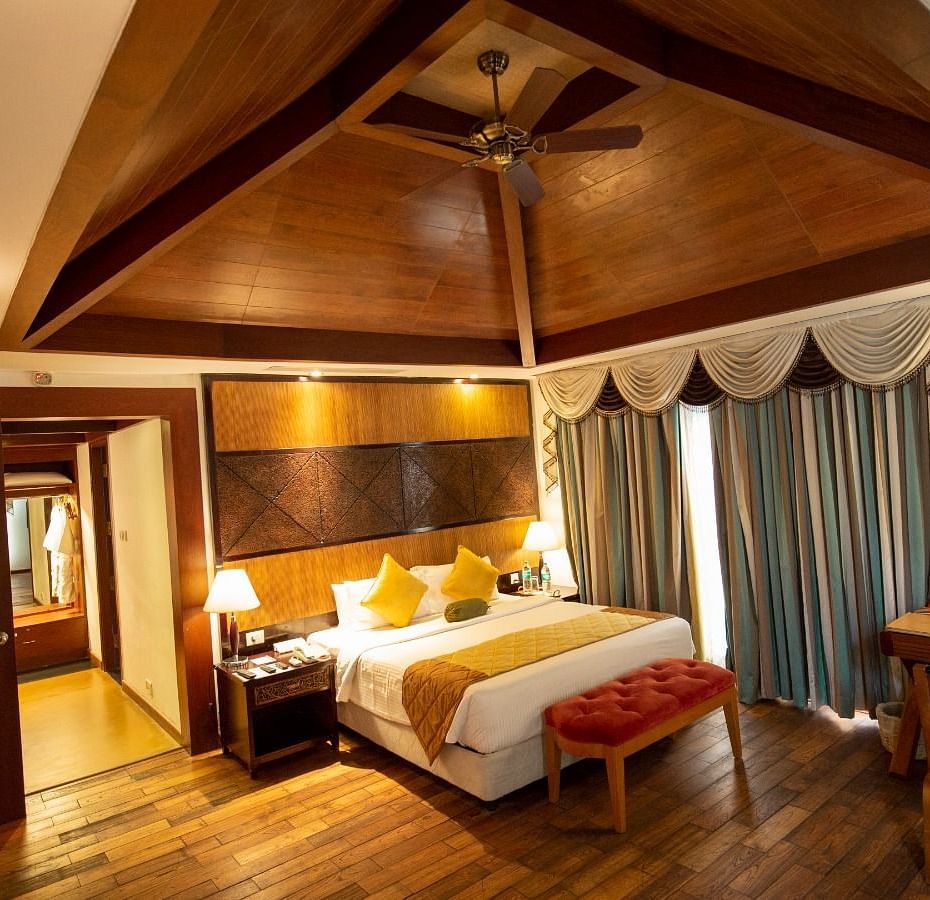 A beautiful interior with table lamp beside the bed at Ocean Spray, Puducherry