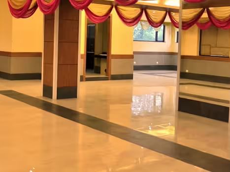 View of banquet hall called The Durbar with polished flooring and ample space for events - Max Hotel Prayagraj.