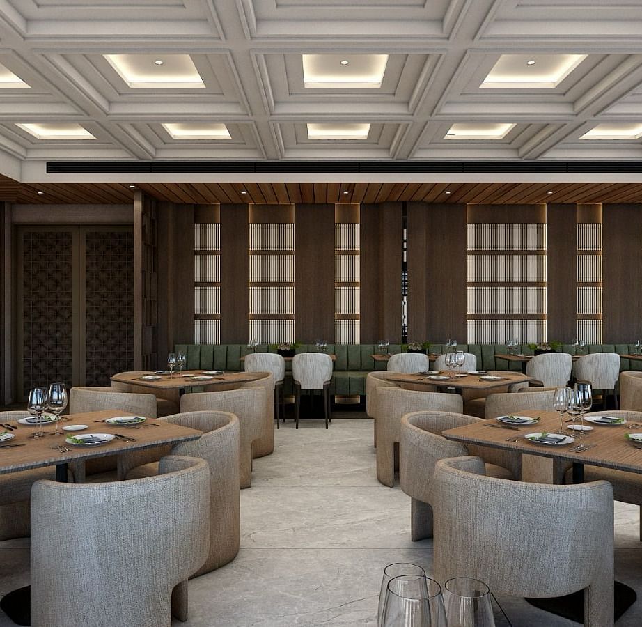 Full view image of the restaurant with featuring an expansive area with grey coloured chairs set around the table - Namaste Corbett
