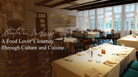 Elegant dining room with white table cloths, turquoise chairs, and large windows.