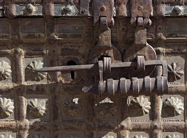 A close up shot of the traditional lock on a wooden gate - MANVAR Resort & Desert Camp