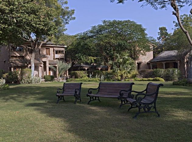 An image of the outdoor seating area with lush greenery around  - MANVAR Resort & Desert Camp