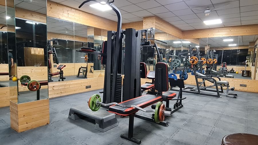 ull view of the fitness centre at Shaheen Bagh with multi-functional machines and spacious layout.