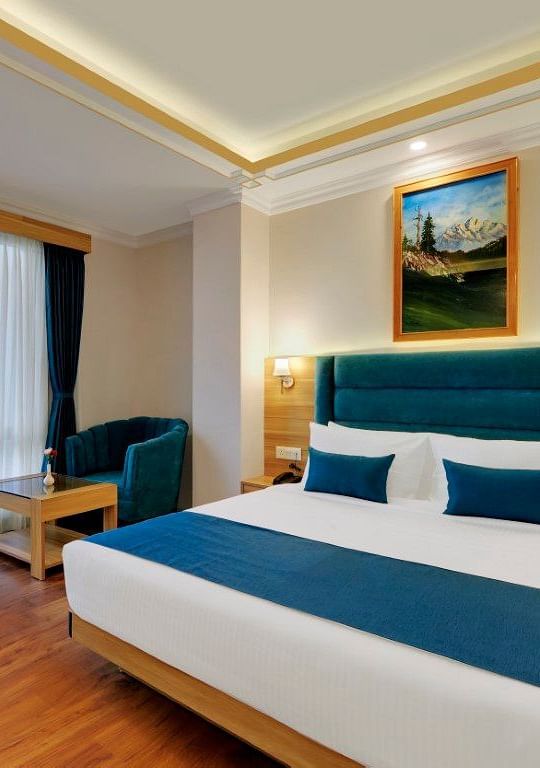 Double bed in the premium room at Yashshree Sikkim Blossom