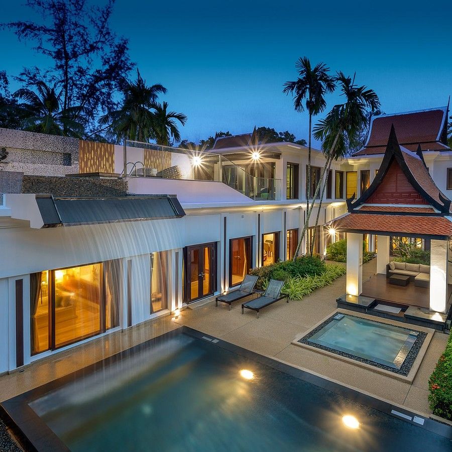 alt-text image taken from a higher level on a late evening of the facade of the villas at maikhao dream villa resort and spa, phuket