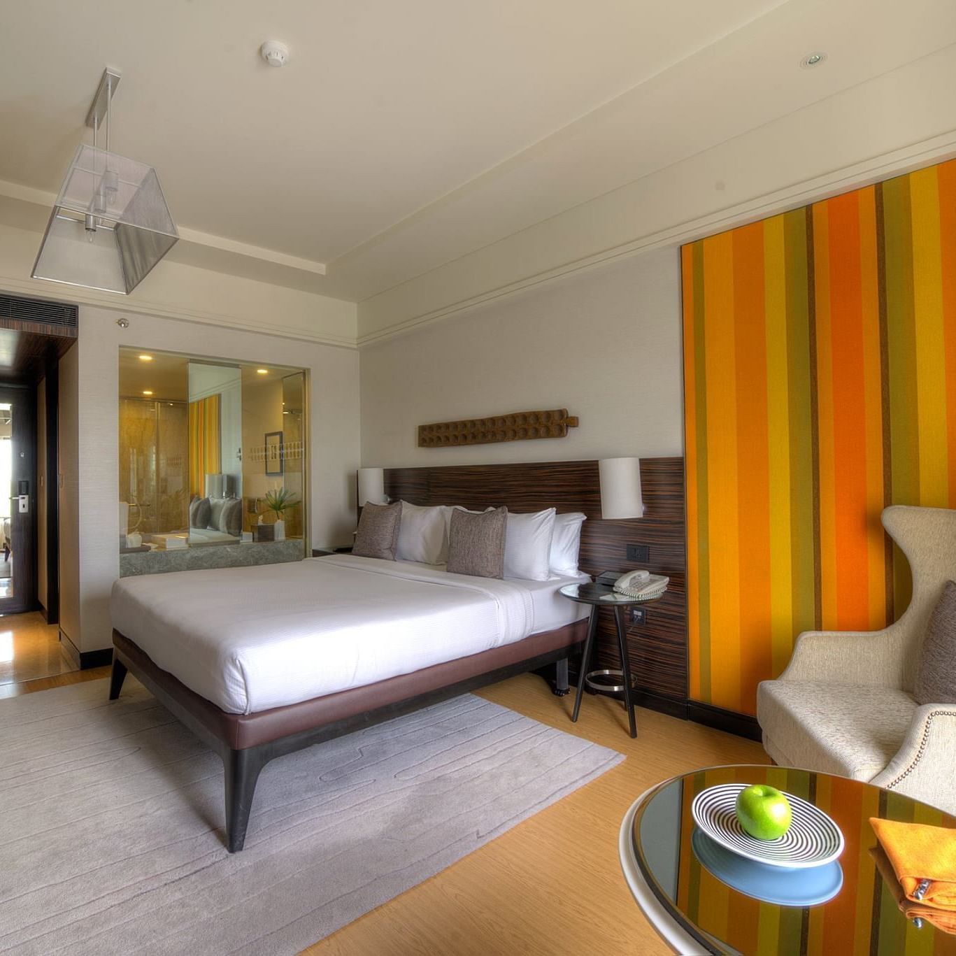 Image of Executive Suite at The Raintree St. Mary s Road with a bed and a sofa