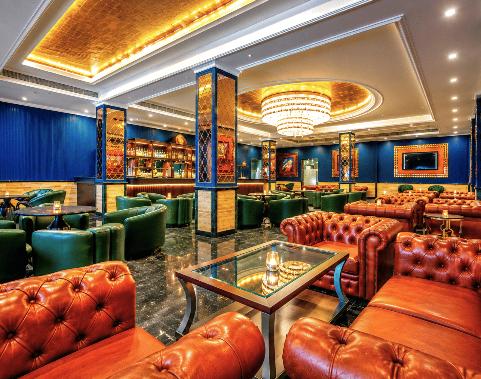 Baron & Baroness Bar with leather seating and vibrant décor at Mayfair Oasis Resort, Jharsuguda