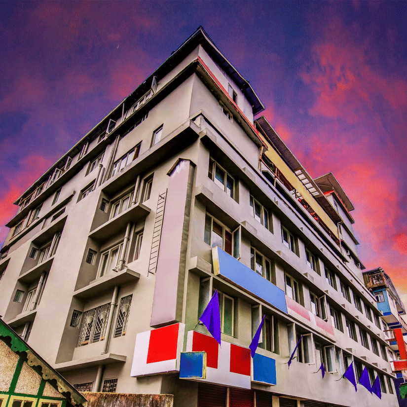 The facade of Mount Conifer Suites & Spa at sunset. 