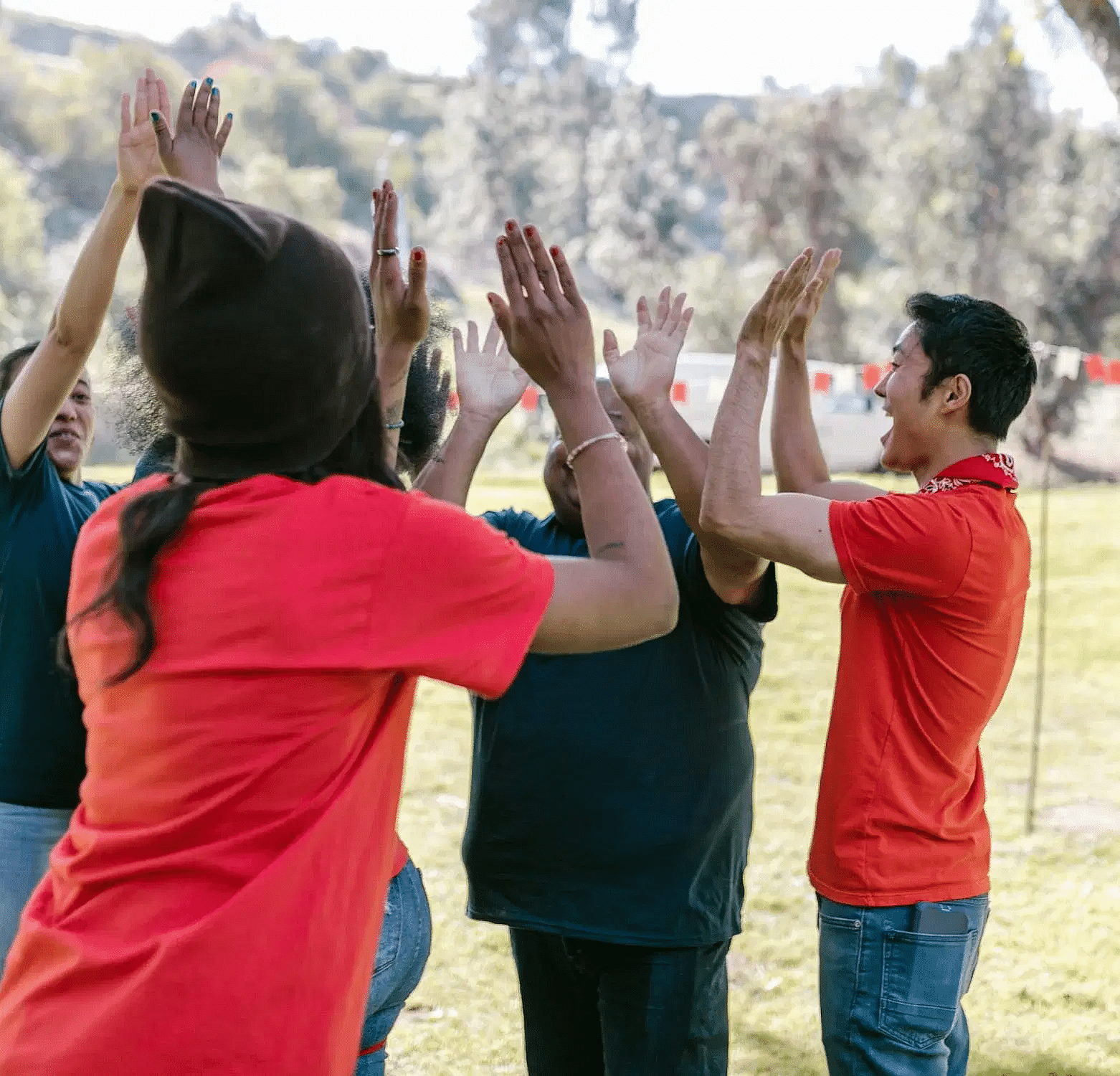 A group of people giving each other a high-five.