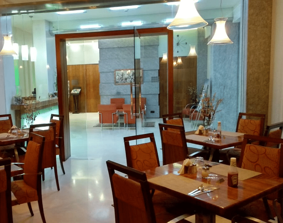 Dining setting of a restaurant at Regency Hotel, Mumbai.