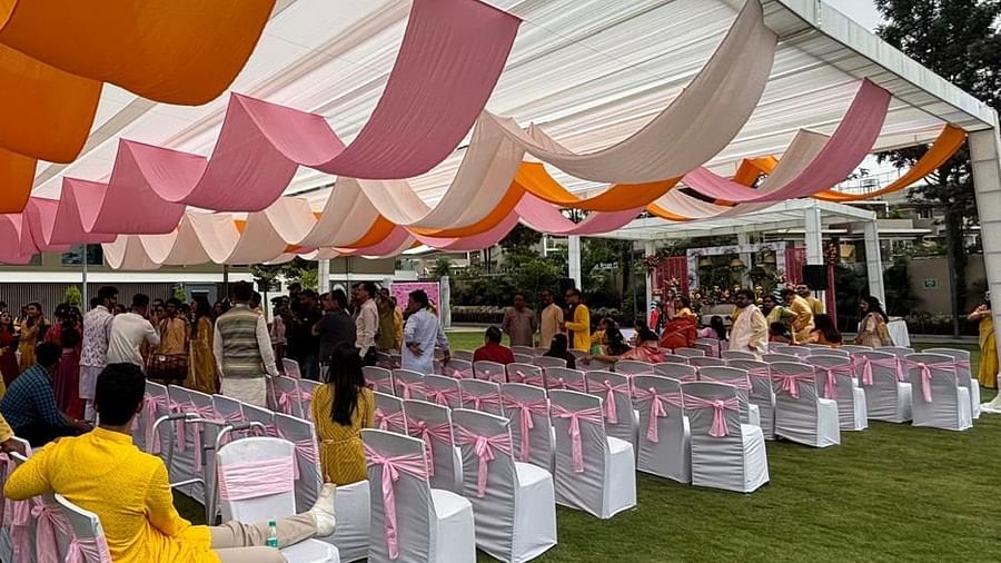 Guests seated under decorative canopies in a well-maintained garden - VRR Astoria Hotel and Conventional Centre