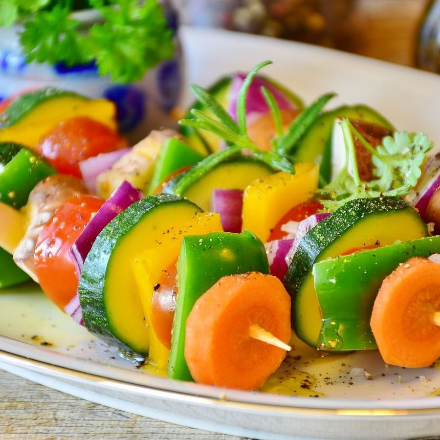 Close up of a plate of vegetable skewers in the restaurant of GK Hill View Resort.