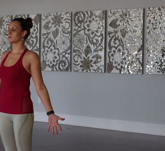 A woman practicing breathing exercises in yoga.