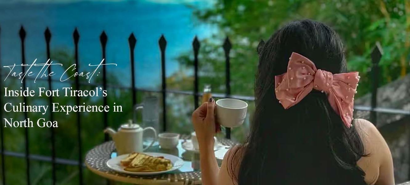 Woman dining outdoors with a large pink bow on her head, text overlay: Taste the Coast: Inside Fort Tiracols Culinary Experience in North Goa.