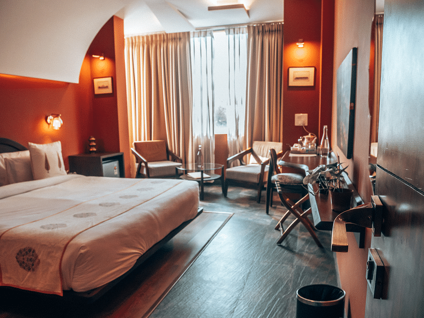 A bedroom at Ekaa Villa & Kitchen with a double bed, side tables and work desk and chair