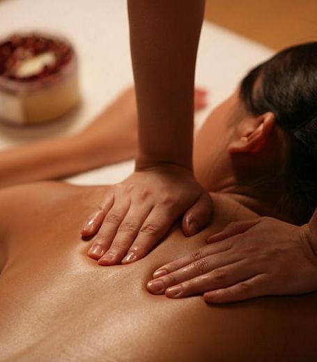 A soothing massage in a tranquil setting, highlighting relaxation and wellness. A perfect escape for rejuvenation | Brewery Gulch Inn & Spa