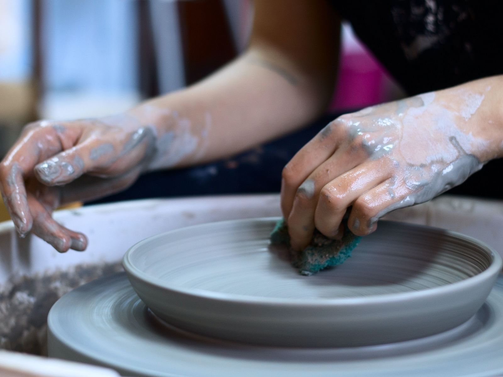 A person at a pottery wheel