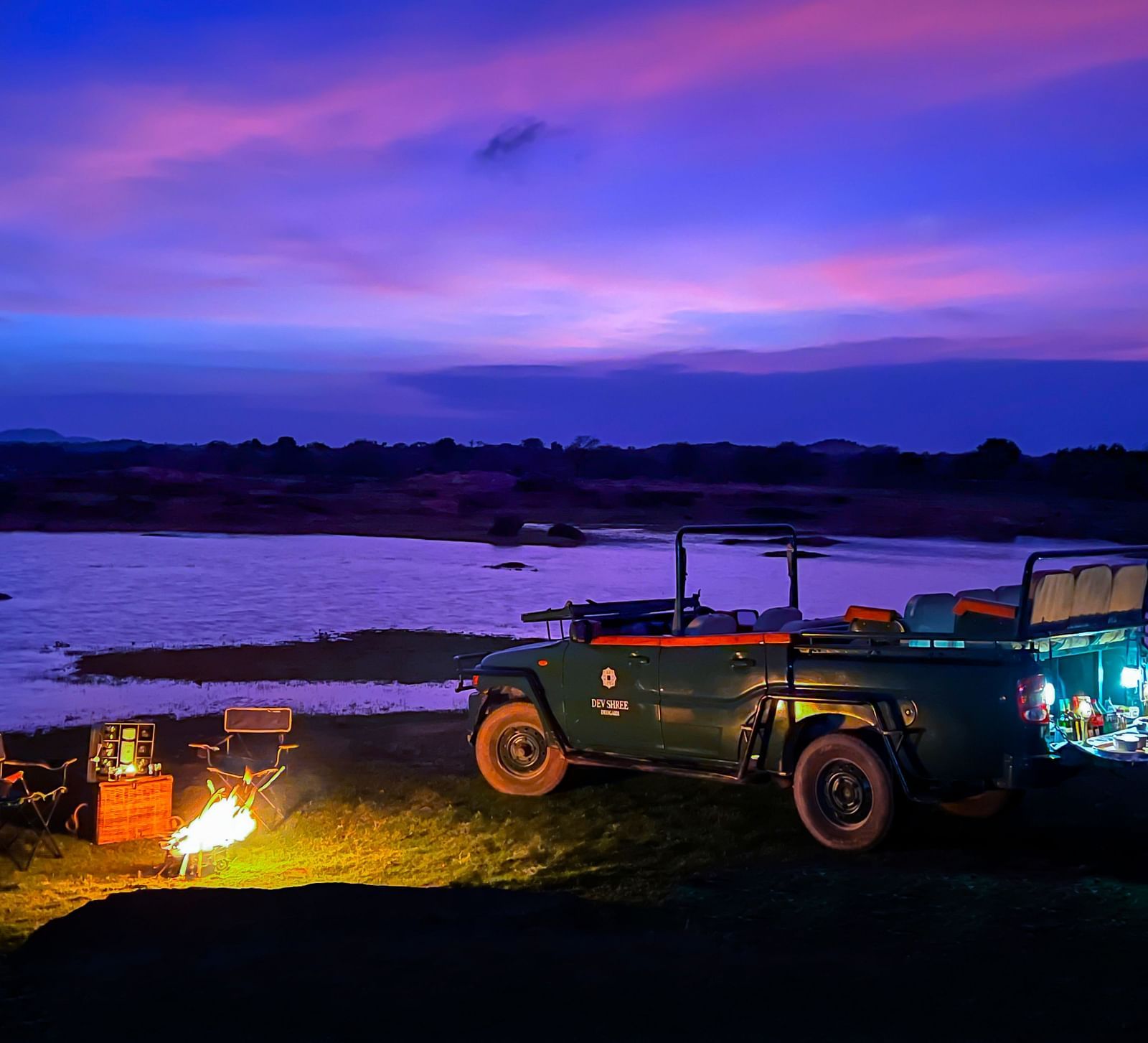 image showing the camping experience near a lake at Sunset at dev shree, deogarh