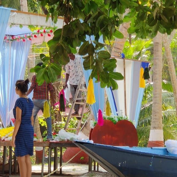 people standing next to the wedding stage