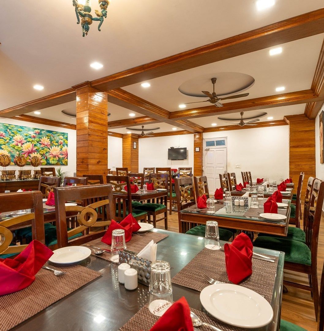 Dining arrangement in the restaurant at Summit Barsana Resort & Spa, Kalimpong