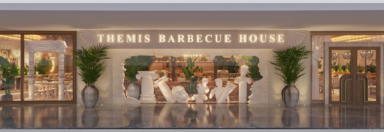 An image of a lobby with statues, sculptures, plants, and other decorative objects at Themis Barbecue House 