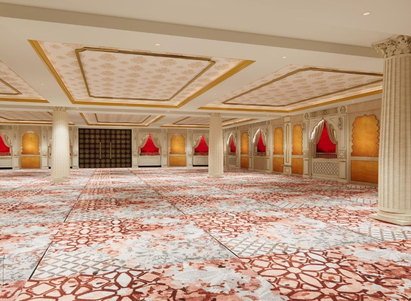 Banquet hall with flower-motif ceilings, tall pillars, warm ambient lights, and wallpaper resembling windows in Indian homes