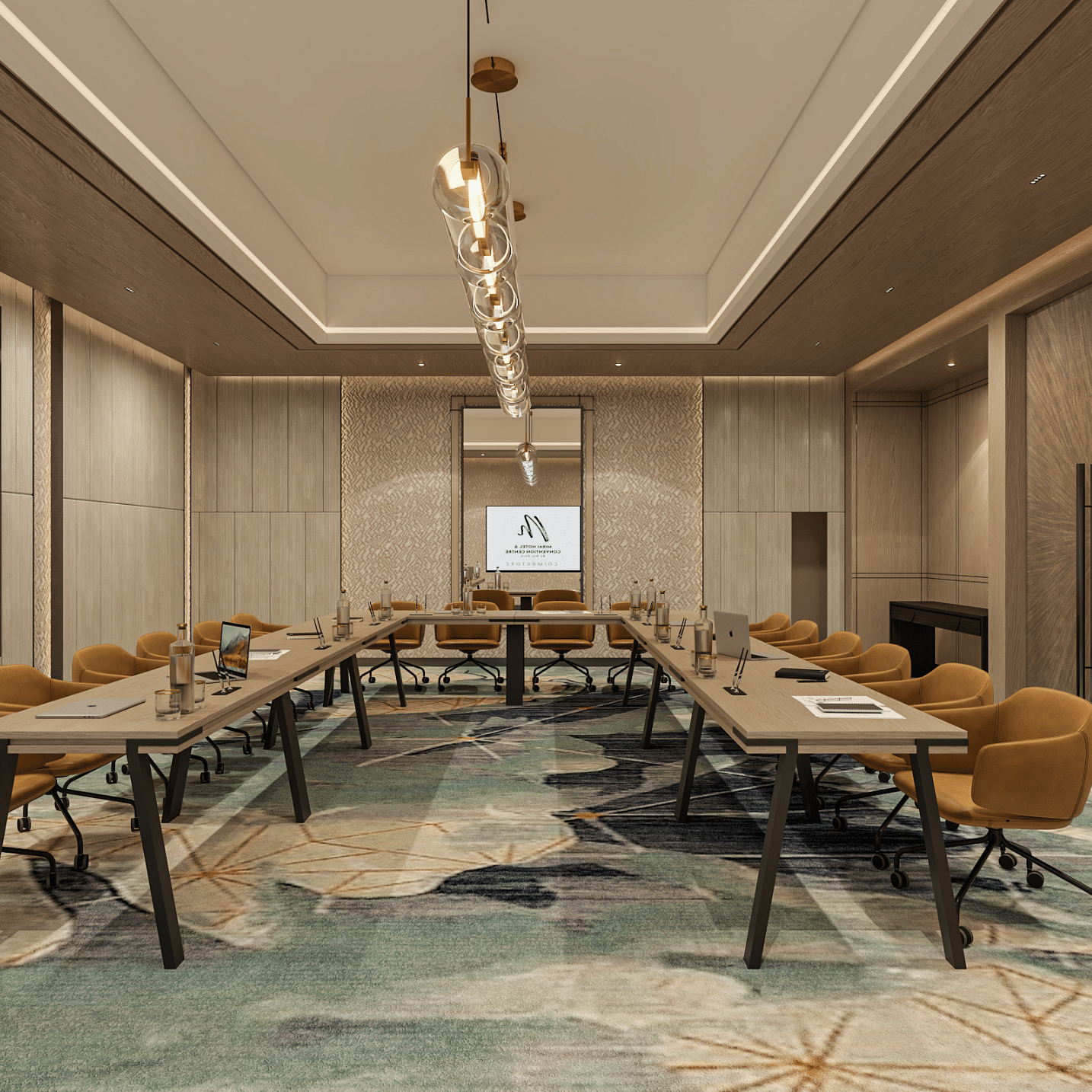 A U-shape boardroom arrangement with a decor frame on the wall, lights and projector