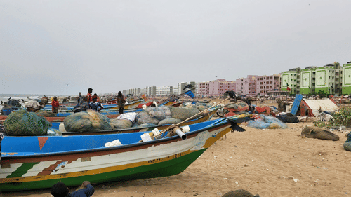 Boats by the shore at Marina Beach
