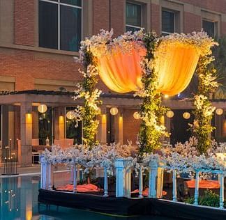 A poolside venue with lavish decoration at evening at Nirvana Luxury Hotel, Ludhiana.