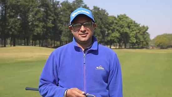 Anup Singh on a gold course during daytime - Karma Lakelands