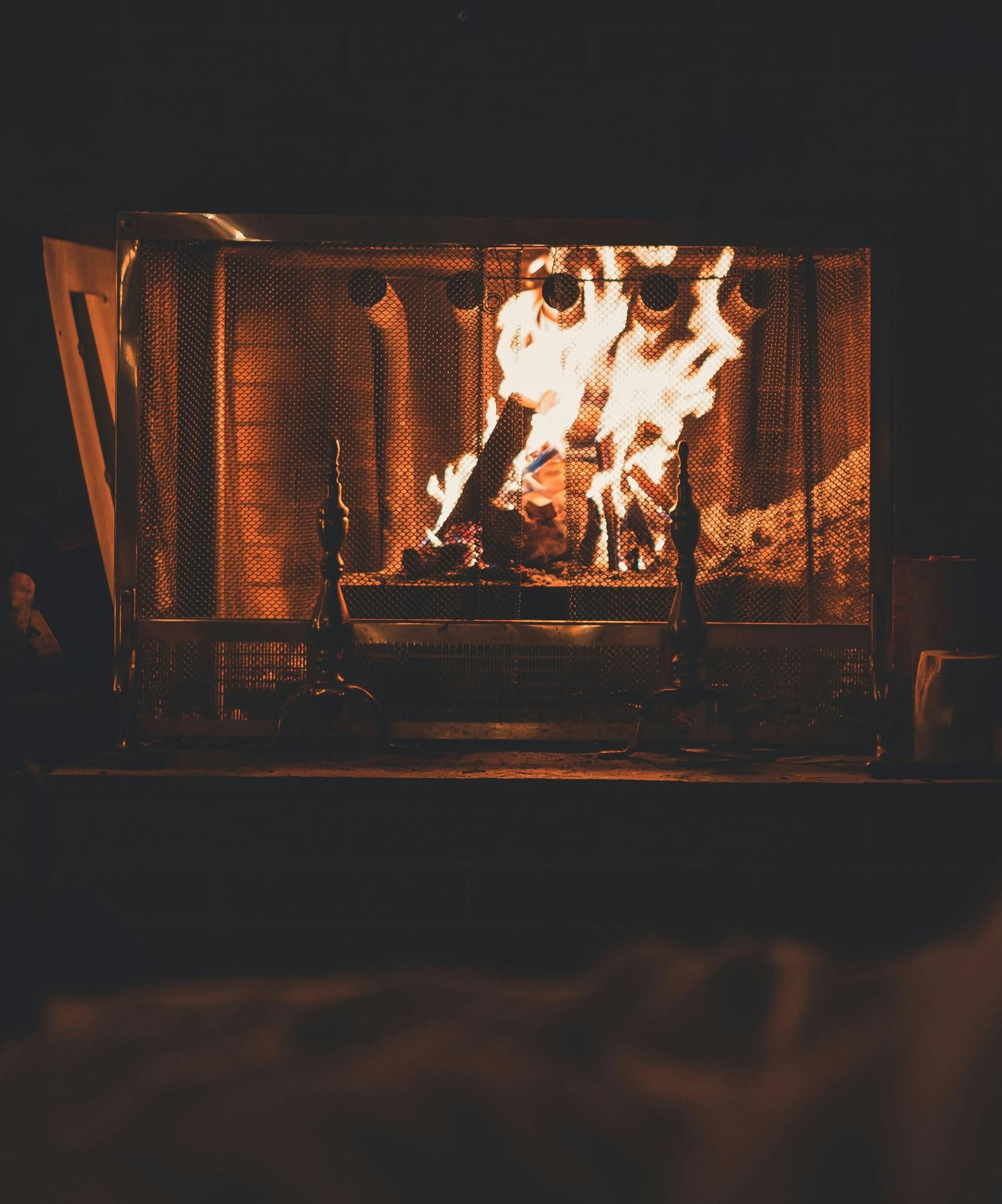 Shot of a fireplace with woods burning.