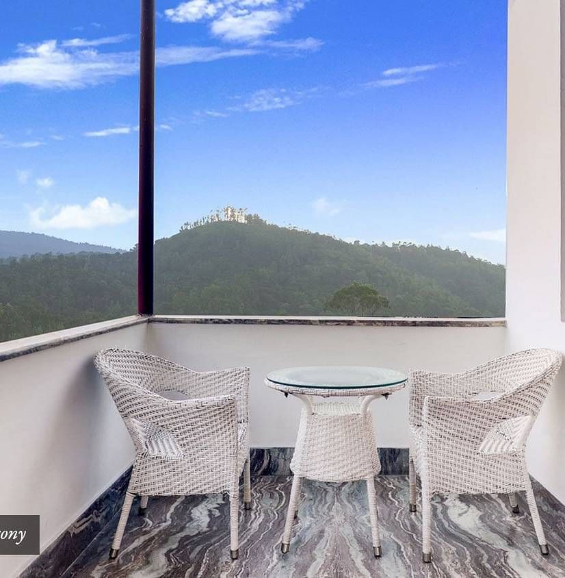 A view of the chairs placed in the balcony at Summit Golden Crescent Resort and Spa.
