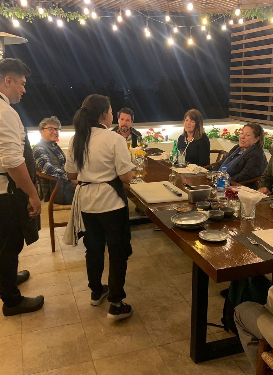 A group of people gathered for the chefs table dinner