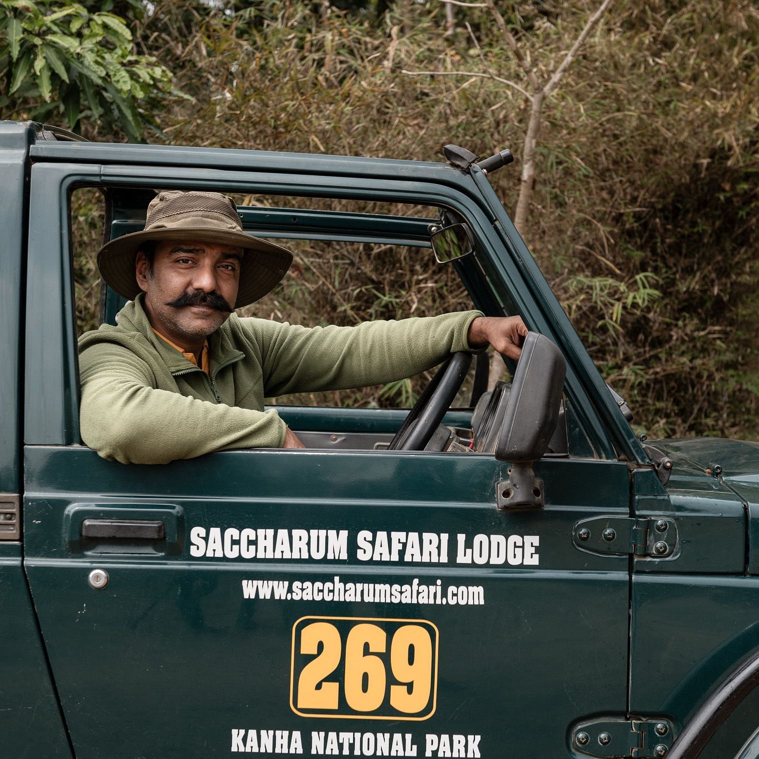 A man sitting in the jeep at Saccharum Safari Lodge, Kanha Tiger Reserve 1