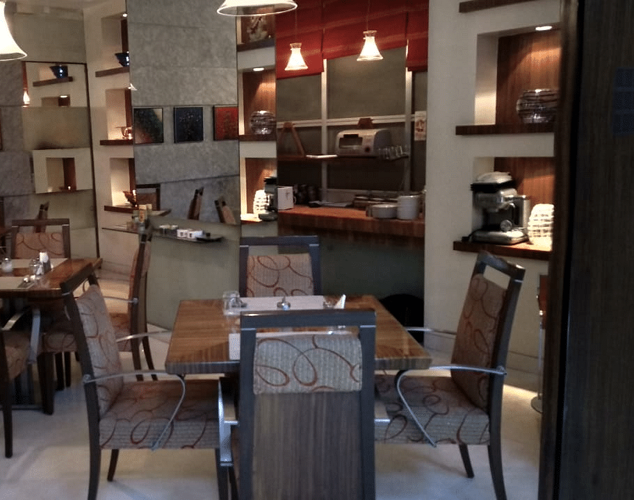 Dining setting of a restaurant at Regency Hotel, Mumbai.