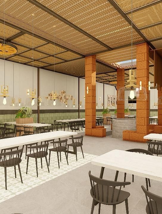 Interior view of a dining area with tables and chairs under a high ceiling | Ayana Resorts & Convention, Hyderabad