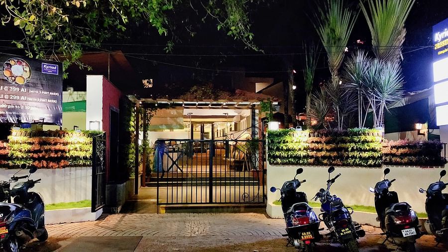 Entrance gate of Kyriad Prestige Calangute, Goa with vehicles parked outside